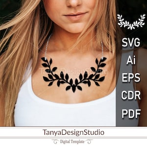 May include: A black leaf-shaped necklace with a silver chain is displayed. The necklace is worn over a white top. The image includes the text "SVG, Ai, EPS, CDR, PDF" and "TanyaDesignStudio".