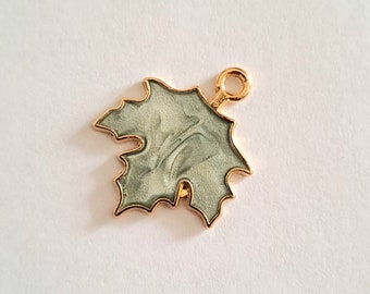 1 maple leaf bead charm, enameled colors, golden outlines