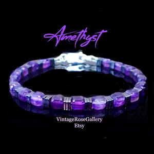 May include: A bracelet with purple amethyst beads and silver-coloured metal details. The word "Amethyst" is written in purple script above the bracelet. The Etsy shop name "VintageRoseGallery" is written below.