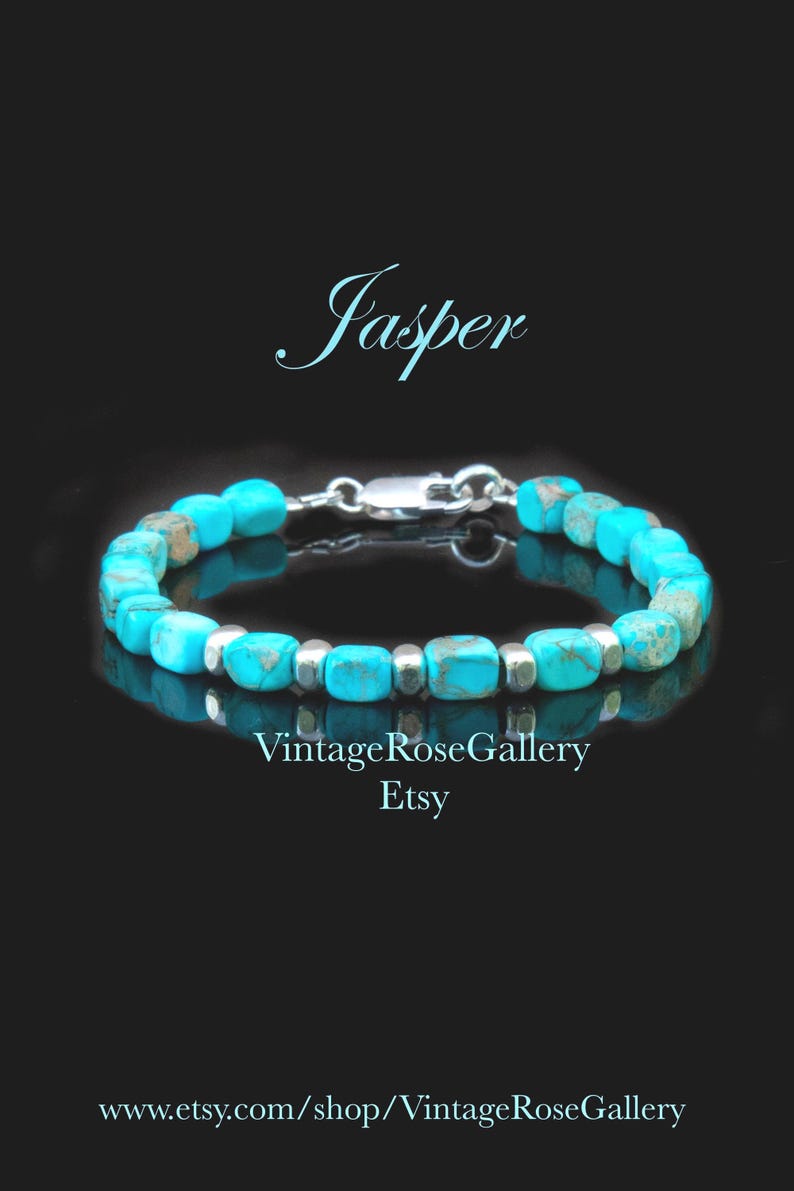 May include: A bracelet featuring turquoise-colored jasper beads with brown veining, interspersed with small silver-toned metallic spacers. The piece includes a silver-toned lobster clasp. Text on the image reads Jasper, VintageRoseGallery Etsy, and www.etsy.com/shop/VintageRoseGallery.