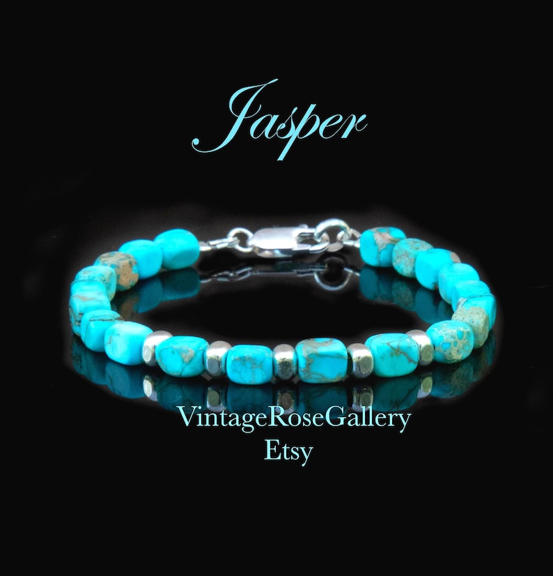 May include: A bracelet featuring bright turquoise blue, cube-shaped jasper beads interspersed with small, smooth silver-toned metal spacers. The piece includes a silver-toned lobster claw clasp. The text Jasper, VintageRoseGallery, and Etsy appear.