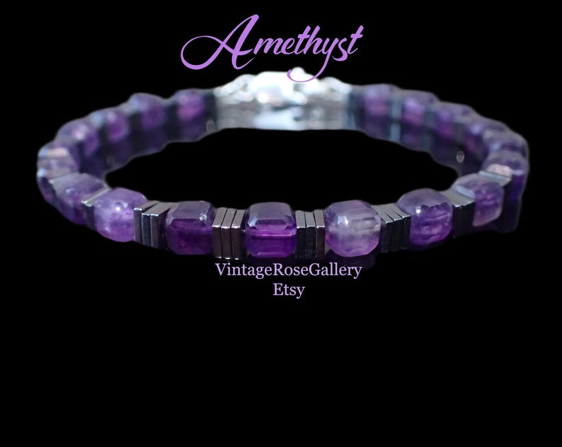 May include: A bracelet with amethyst gemstones and silver-coloured metal details. The bracelet has rectangular and rounded purple amethyst beads, with silver-coloured metal bars between them. The word "Amethyst" is written in a cursive font, and the Etsy shop name is also visible.