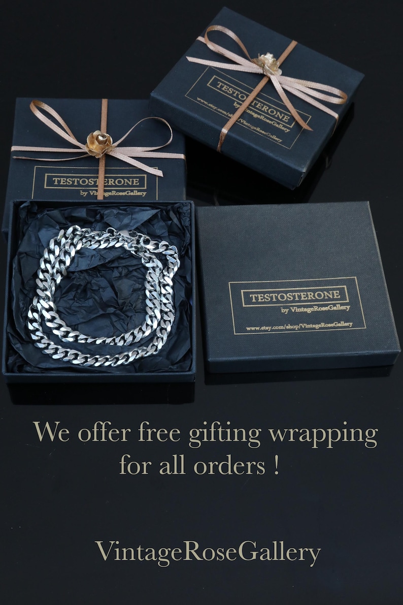 May include: A silver-toned curb chain necklace rests inside a black square gift box lined with black tissue paper. Two additional black gift boxes are present, each tied with a light brown ribbon and featuring a label that reads TESTOSTERONE by VintageRoseGallery.