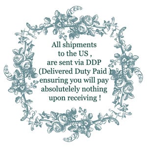 May include: A square frame composed of intricate, dark teal botanical illustrations featuring roses and lily of the valley. The center contains the text: All shipments to the US, are sent via DDP (Delivered Duty Paid) ensuring you will pay absolutely nothing upon receiving!