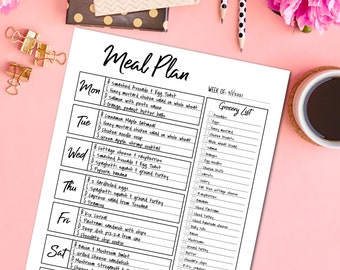 May include: A printed meal plan on white paper with a black border, featuring a weekly schedule and a grocery list. The text includes daily meal suggestions and a checklist for groceries. The background is pink with a coffee cup and flowers.