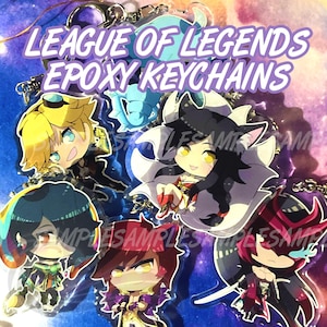 May include: A collection of League of Legends epoxy keychains featuring various chibi-style character illustrations. The text LEAGUE OF LEGENDS EPOXY KEYCHAINS is printed in white with a purple outline at the top of the image.