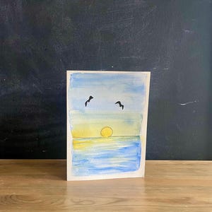 Cartão em branco pintado à mão com pôr do sol