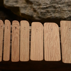 May include: Set of eight wooden tools for spreading and smoothing icing, with numbers 1.5, 2, 2.5, 3, 4, 5, 6, and 8 printed on each tool.