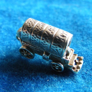 B) Vintage Sterling Silver Charm Wild West Wagon opens