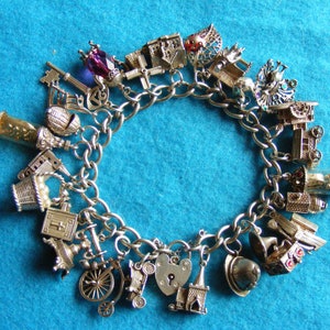 Rare Nuvo Vintage Sterling Silver Charm Bracelet with 25 Nuvo charms - some opening, crystal