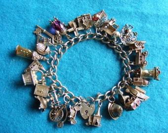Rare Nuvo Vintage Sterling Silver Charm Bracelet with 25 Nuvo charms - some opening, crystal