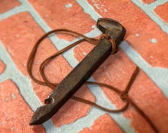 Abridor de botellas con punta de ferrocarril antiguo