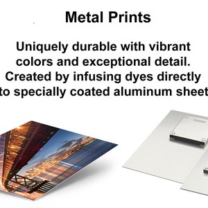 May include: Two metal prints, one with a nighttime cityscape and bridge, the other with a blank surface. Metal prints are uniquely durable with vibrant colors and exceptional detail. Created by infusing dyes directly into specially coated aluminum sheets.