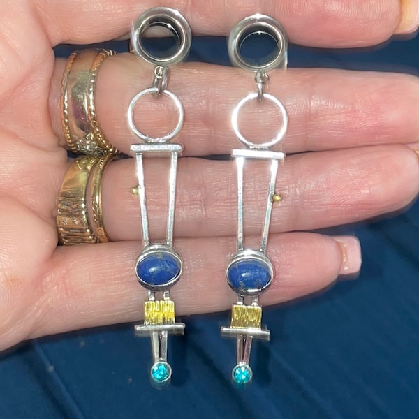 Faux lapis and rhinestones dangle tunnels. 00g or 10mm.