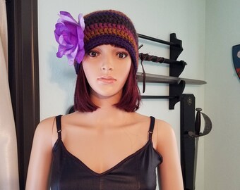 Purple and brown hat with flower