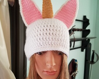white hand crocheted nicorn hat with gold horn
