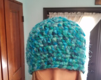 variegated fuzzy beanie in shades of teal