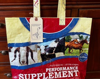 Repurposed cow horse goat mineral sack made into a reusable tote / recycled grain feed bag