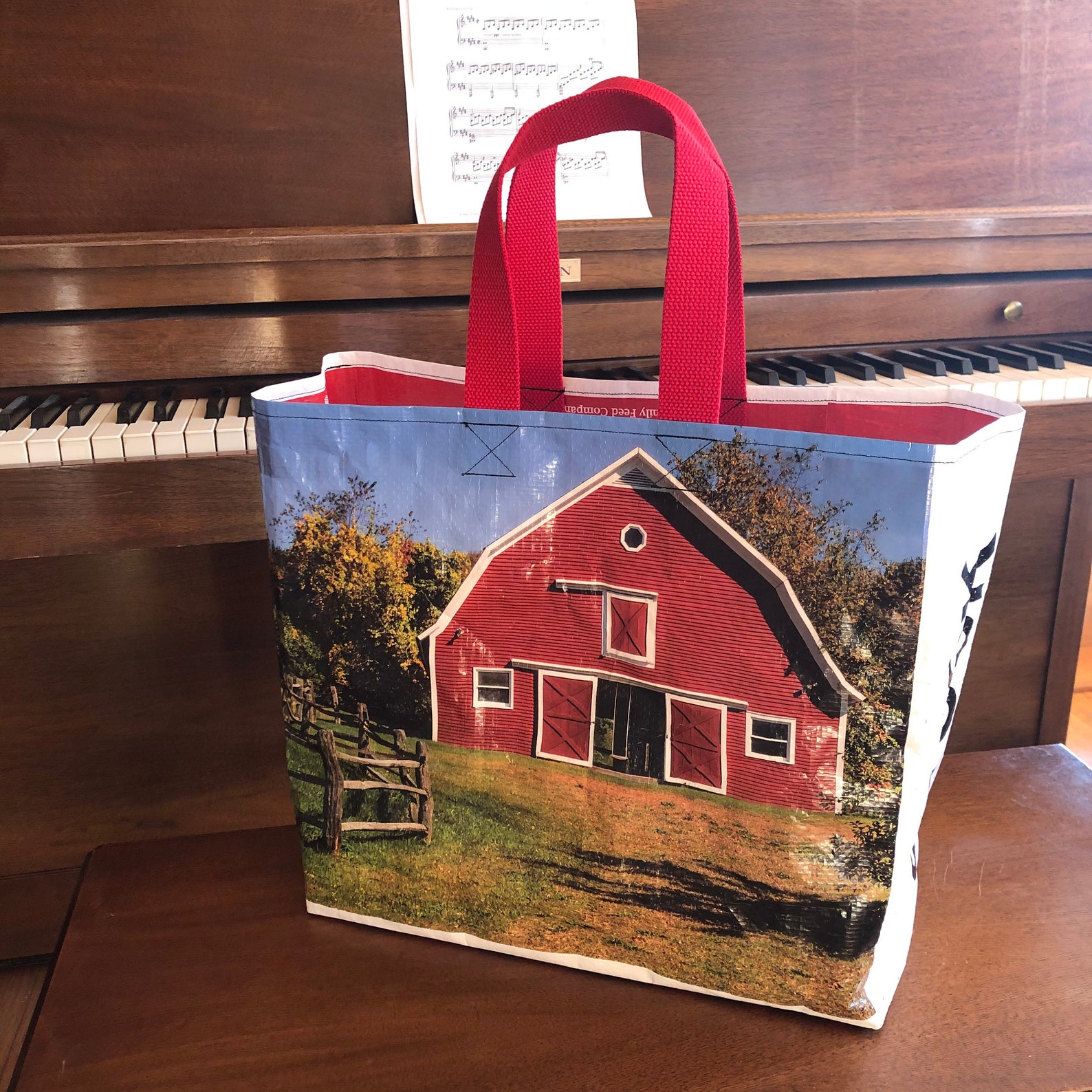 Recycled animal feed bag with red barn made into a reusable Etsy
