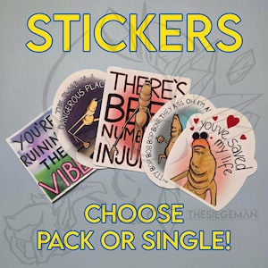 May include: A collection of stickers with humorous illustrations and text. The stickers feature cartoon characters with various phrases, including "YOU'RE RUINING THE VIBE" and "THERE'S BE NUMB INJU". The word "STICKERS" is at the top.