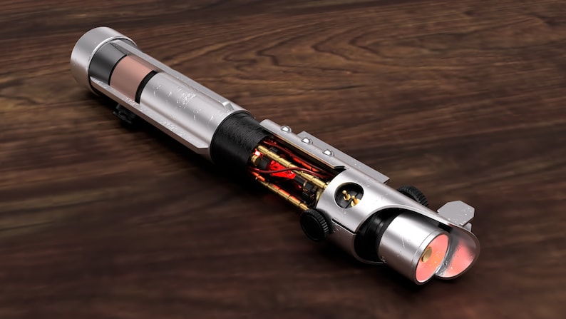 May include: A silver lightsaber with a black handle and a red glowing blade. The lightsaber is disassembled, revealing the internal workings.