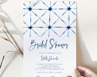 May include: A blue and white bridal shower invitation with a geometric pattern. The invitation reads "Bridal Shower" and includes the bride-to-be's name, "Stelle Daniels", the date and time of the shower, the location, and RSVP information. The invitation also states that the bride-to-be is registered at Target and Amazon.