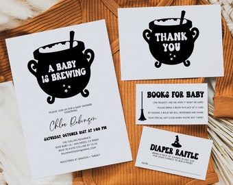 May include: A Halloween-themed baby shower invitation set. The invitation, thank you card, and inserts for books and nappies feature a black cauldron graphic. The set is displayed on a brown babygrow.