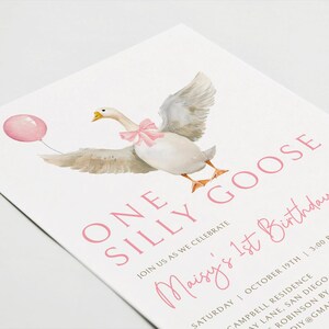 May include: A pink and white birthday invitation with a watercolor illustration of a goose wearing a pink bow and holding a pink balloon. The text reads "One Silly Goose Maisy's 1st Birthday".