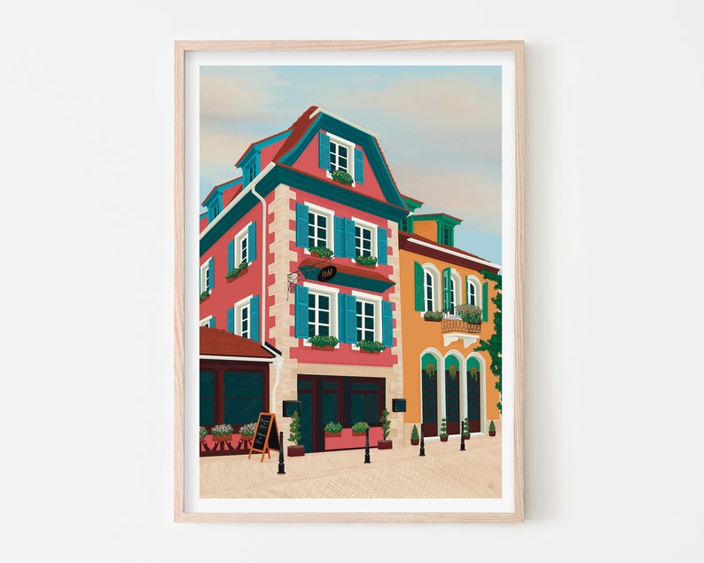 Art print depicting the colourful buildings of Alsace, France, adorned with flowers on a cobble stone street.