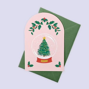 Laissez-le faire carte de Noël boule de neige, jolie carte de Noël rose, carte de fête peinte, carte de Noël illustrée, sapin enneigé et houx