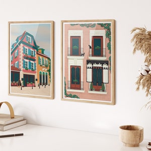 Set of two art prints. One is of Alsace, France and the other is of Madrid, Spain