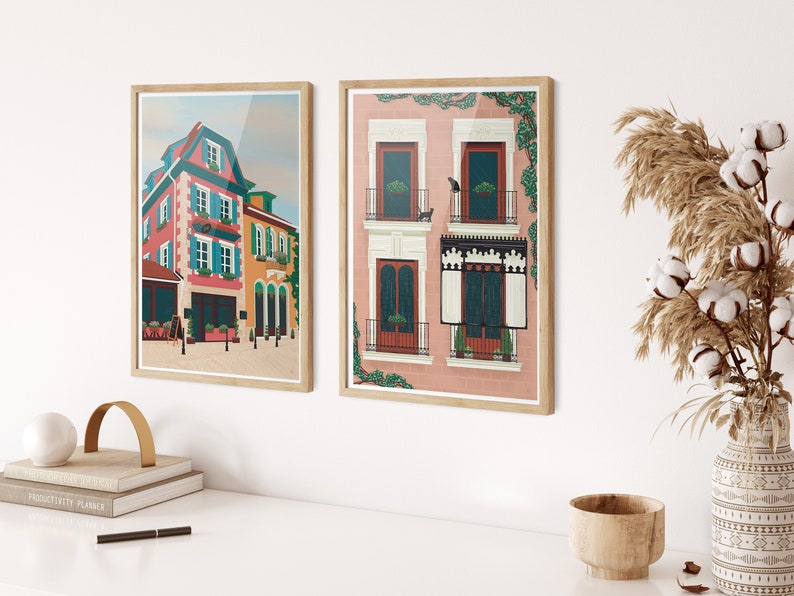 Set of two art prints. One is of Alsace, France and the other is of Madrid, Spain