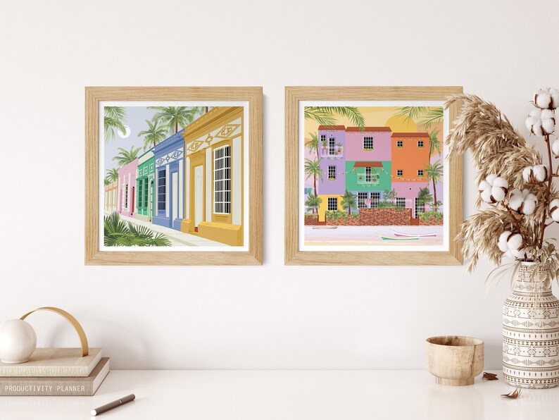 A collection of Venezuelan art prints in the form of a gallery wall featuring a beach and houses in Maracaibo.