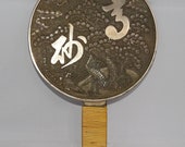 Antique Meiji period Japanese metal Kagkimi hand mirror with embossed scene