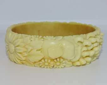 Cream/yellow moulded Celluloid Bangle Bracelet With Floral & Elephant Decoration