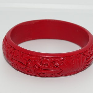Beautiful red Cinnabar resin moulded deep relief floral patterned bangle