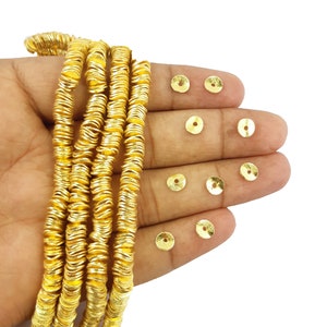Of Brushed Gold Plated Wavy Disc 6mm Bead Spacers, Selling Per Strand, 8 Inch Long Strand.
