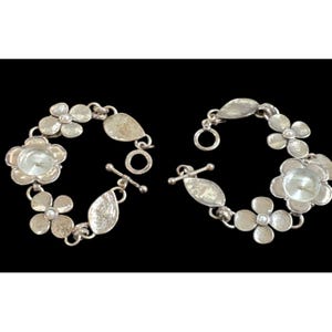 May include: A set of three ceramic mugs with a speckled, matte finish. The mugs are in shades of cream, light brown, and dark brown. Each mug has a simple, minimalist design, perfect for coffee or tea.