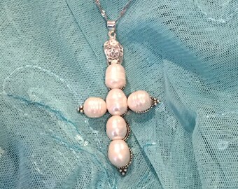 Cross made of Cultured Pearls and matching 10-11mm Cultured Pearl Earrings. 26” Stainless Steel delicate chain