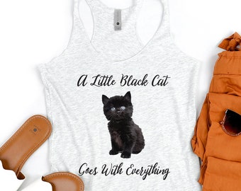 May include: A gray tank top with the text "A Little Black Cat Goes With Everything" and a black cat image. The tank top is paired with brown pants and white sandals.