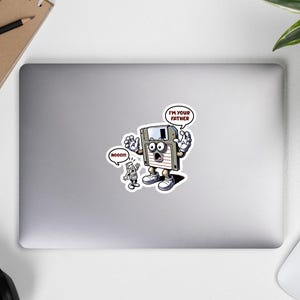 May include: A sticker featuring a cartoon floppy disk character with the text "I'M YOUR FATHER" in a speech bubble. A smaller, cartoon computer character says "NOOOO!!" in a speech bubble. The characters are on a white background.