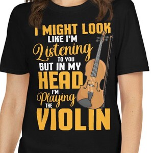 May include: Black t-shirt with a yellow graphic of a violin and the text "I might look like I'm listening to you but in my head I'm playing the violin."