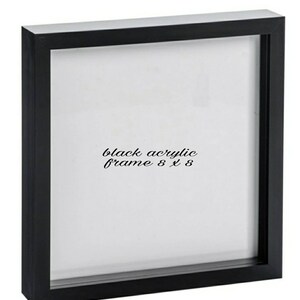 May include: Black acrylic picture frame with a white mat and a black border. The frame is 8 inches by 8 inches.