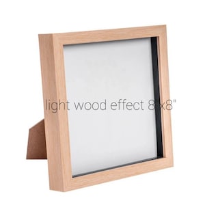 May include: A light wood effect picture frame with a black mat, measuring 8 inches by 8 inches.