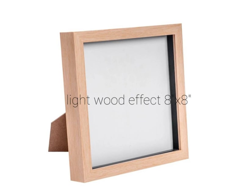 May include: A light wood effect picture frame with a black mat, measuring 8 inches by 8 inches.