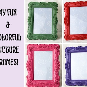 May include: Four ornate picture frames in different colours: green, red, pink, and purple. The frames have a decorative floral design.
