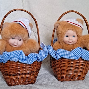 Anne Geddes Baby Bear Doll wearing a Bear Costume while sitting in a Basket, Blue eyes or Brown eyes