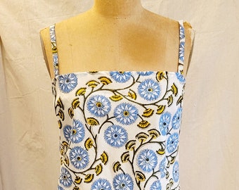 floral print slip dress, A-line mini with spaghetti straps and lace trim. 1960s reproduction in block print fabric from India.