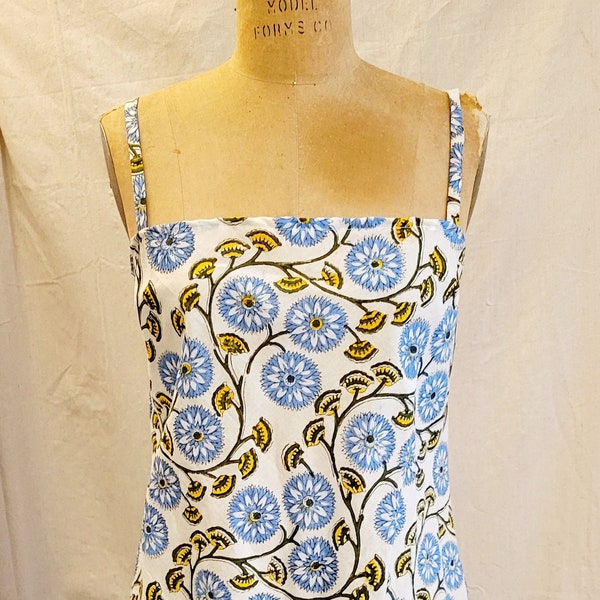 floral print slip dress, A-line mini with spaghetti straps and lace trim. 1960s reproduction in block print fabric from India.