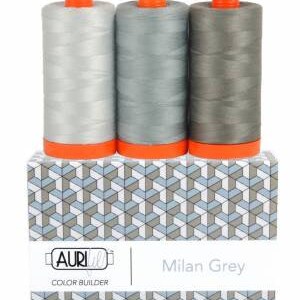 May include: Three spools of thread in shades of gray, labeled "Milan Grey" and "AURI Color Builder".